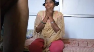A young woman from the Telugu region engages in explicit sexual activities in a heated video