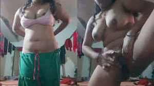 Beautiful woman with large breasts captures herself in a selfie