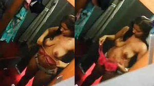 Desi babe tries on clothes in changing room