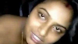 A South Asian wife moans loudly while being vigorously penetrated in the dog position