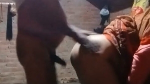 Middle-aged Indian woman engages in doggy style sex in rural setting