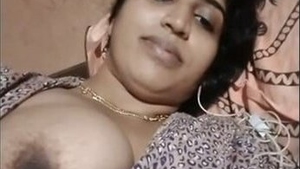 Indian bhabhi flaunts her boobs and pussy in a steamy video clip
