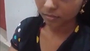 A college girl with large breasts displays them in a sensual video using tech