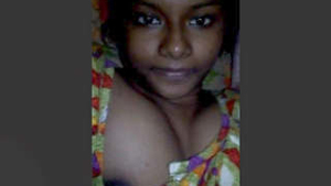 Cute Indian girl flaunts her big tits in a solo video