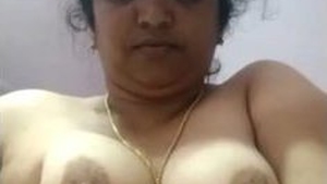 Mature aunty strips and fingers herself in sari