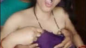 Aroused brother-in-law sensually fondles attractive sister-in-law's breasts