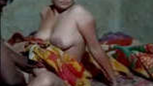 A man pleasures his wife's vagina with his hands