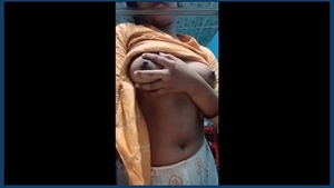 A lovely Indian girl displays her beautiful breasts