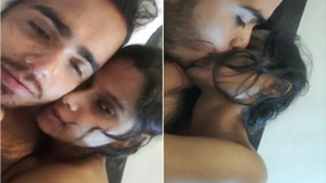 Desi couple enjoys passionate kissing in bedroom with soft music