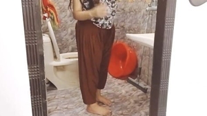 Desi daddy sneaks into shower to watch stepdaughter have sex