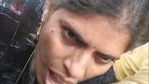 Mature Randi gives a blowjob to a client in a car