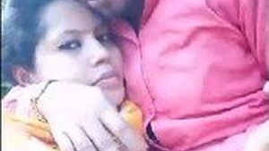 An enticing Indian girl with large breasts pleasures her partner with a sensual outdoor blowjob