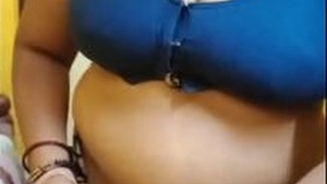 Tamil aunty flaunts her big boobs and changes into sexy lingerie
