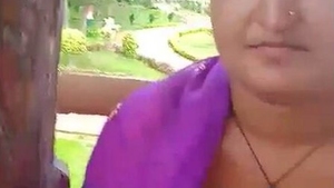 A wife and her partner have fun with outdoor breast fondling at the park