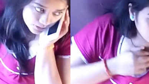 A pretty Indian college girl lightly touches and scratches her breast on a train without exposing herself