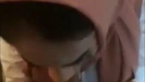 A seductive woman wearing a hijab pleases her partner with an erotic oral experience