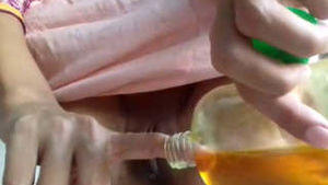 Horny girl uses mustard oil to pleasure herself in solo video