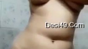 Indian desi girl enjoys a steamy bathroom encounter in XXX video