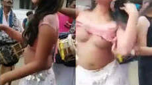 Naked prostitute dances in public place in front of people