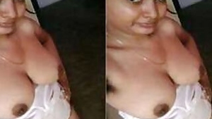 Female is Desi and feels free to perform XXX show of her breasts