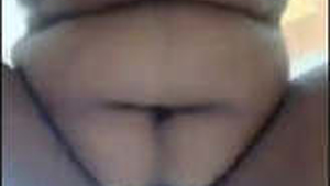 A muscular wife of size fondles and orally pleasures her pussy on camera