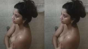 Watch a naughty babe get down and dirty in the bathtub