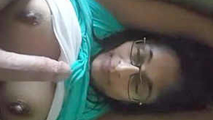 Indian girlfriend with large breasts performs oral sex