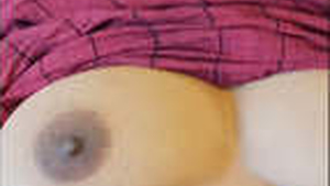 Playful husband explores his wife's soft breasts in a private video