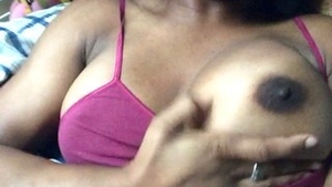 Indian woman reveals her breasts and massages herself