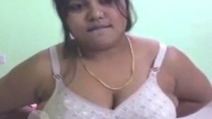 Watch a gorgeous Indian babe strip down and tease