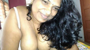 Busty Indian Auntie Sucking Cock