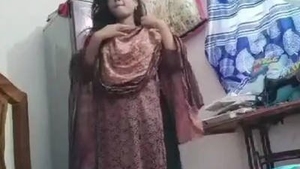 A cute Indian girl reveals her body on camera from a village background