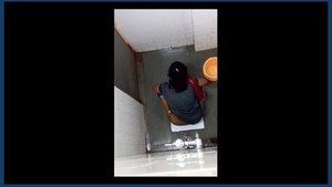 Secretly filmed women engage in intimate activities in bathroom