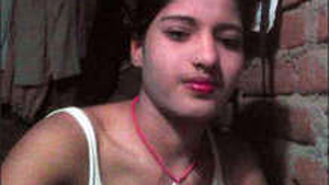 Indian girl goes nude in village setting