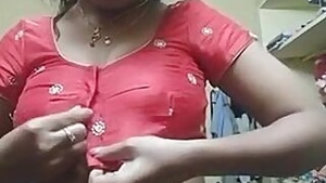 Indian girl wears pink bra and red top on camera in her bedroom