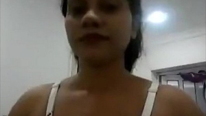 Elderly Sri Lankan woman in a white lingerie