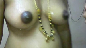 Indian aunt undressed at home with her spouse providing water