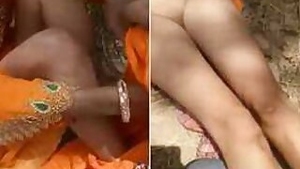 Man watches Desi girlfriend in orange sari taking pants off for XXX video
