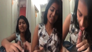 A sweet college student performs oral sex on her lover in a video