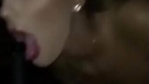 Drunk girl deepthroats a champagne bottle at a party